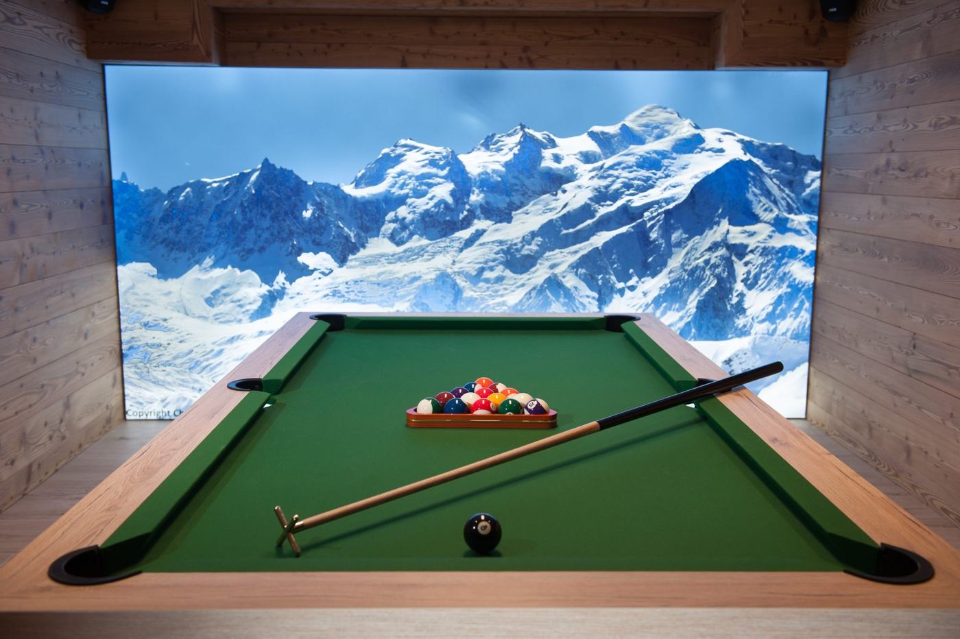 Pool table facing a Mont Blanc panorama