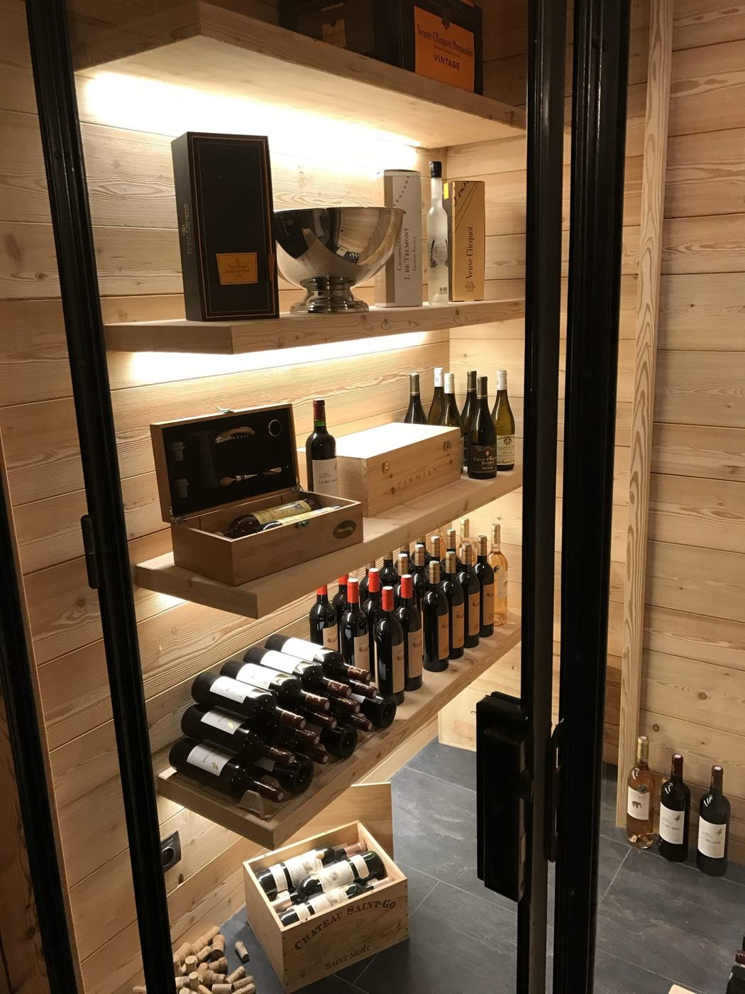 Lit wine cellar with champagnes