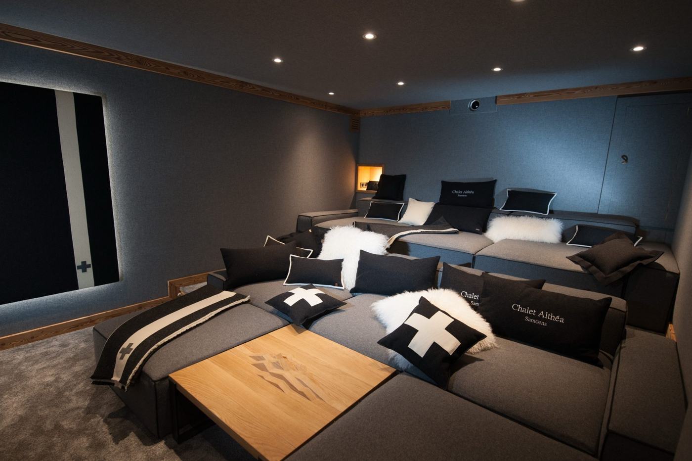 Cinema room with tiered sofas